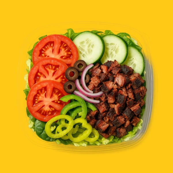 Jay's Deli salad with diced meat, tomatoes, cucumbers, olives, red onion, and peppers.