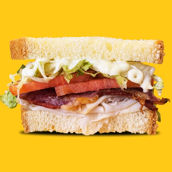 A Jay's Deli sandwich with turkey, bacon, lettuce, tomato, and mayonnaise on white bread.